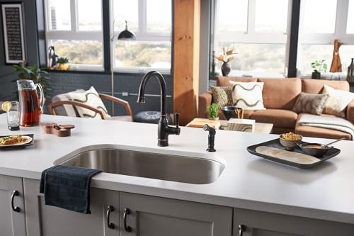 Moen Noell old-world finish detail enhances traditional kitchen decor.