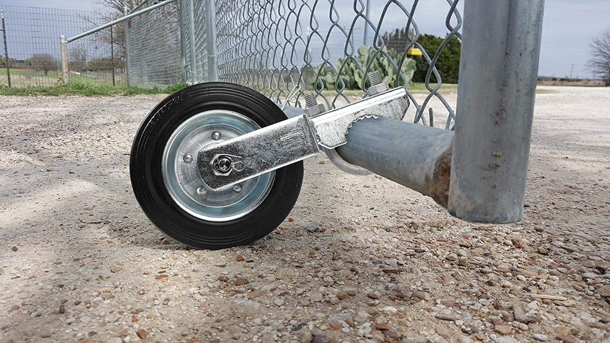 MOFEEZ gate wheel attached to a metal swing gate for smooth movement on concrete.