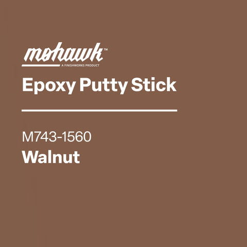 Mohawk Epoxy Putty Stick Walnut into gap on wood.