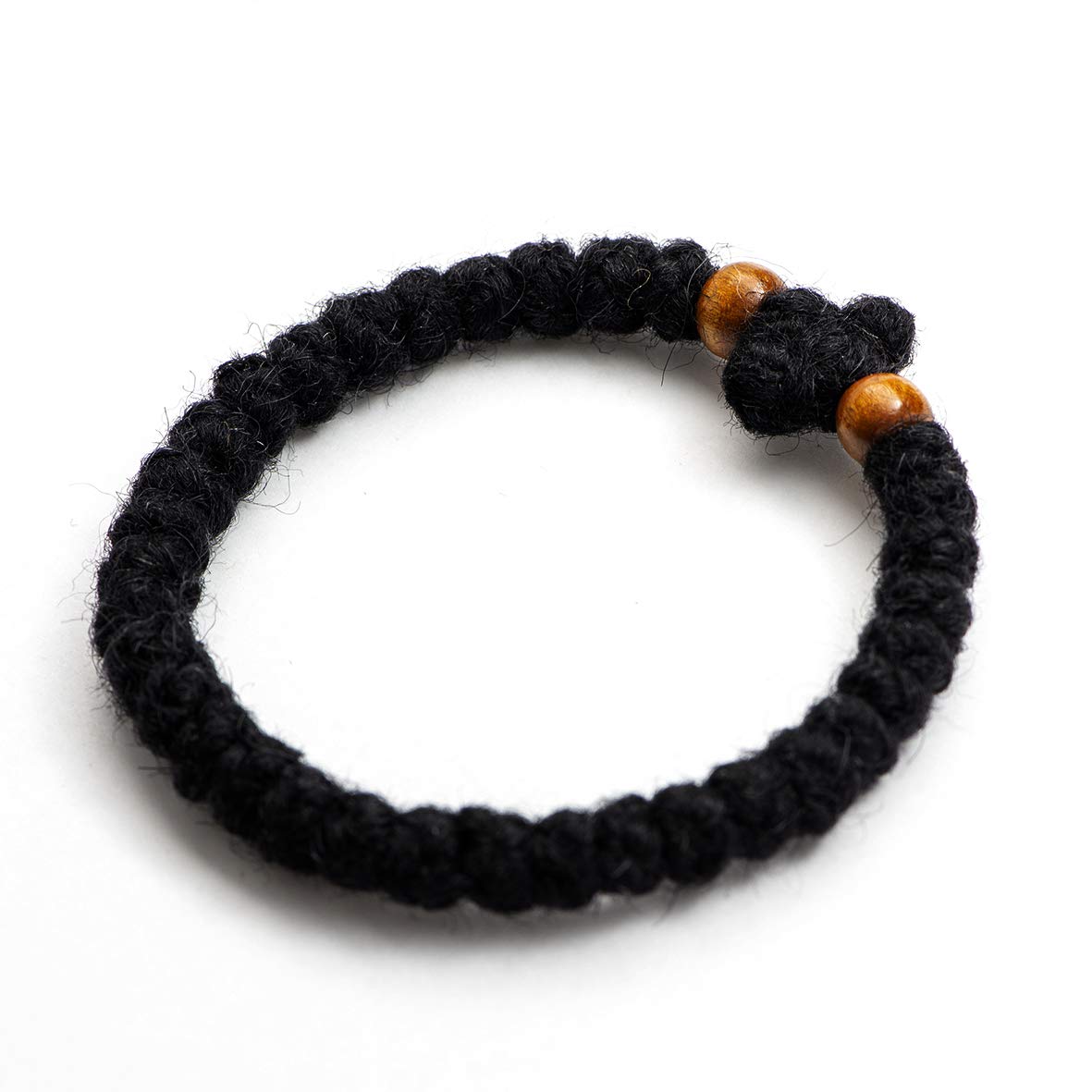 Monastery Vodoca wooden beads detail highlights traditional craft and tactile focus during prayer.
