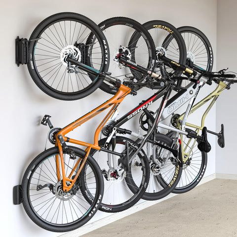 monTEK Swivel Bike Wall Mount four-pack packaging demonstrates space-saving storage solution