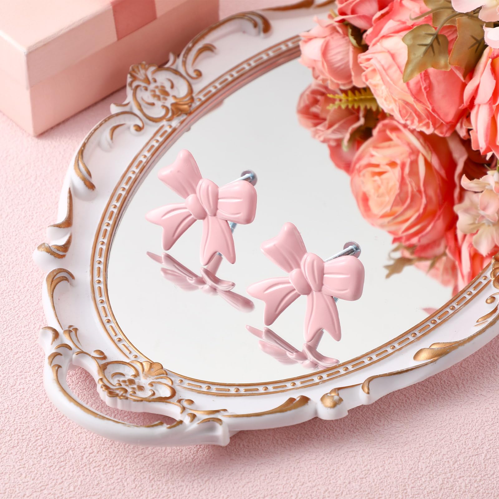MorningRo pink bow knob enriches a bookcase with vintage-coquette flair