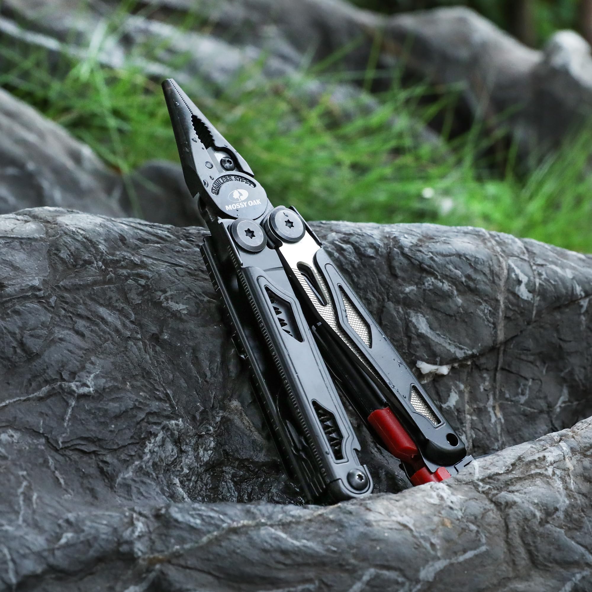 MOSSY OAK stainless steel multitool in rugged outdoor use.