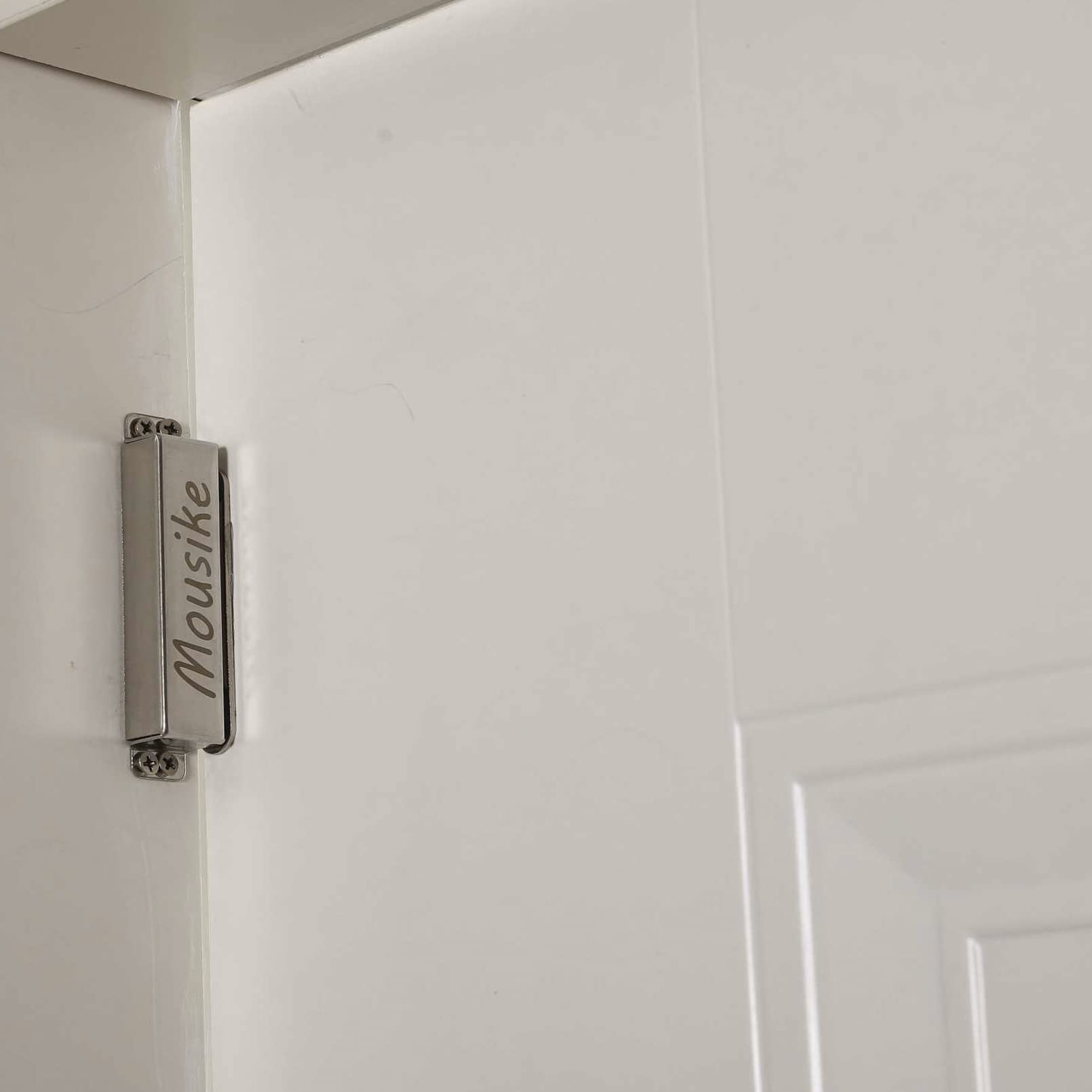 Mousike door catch installed on cabinet and wardrobe doors