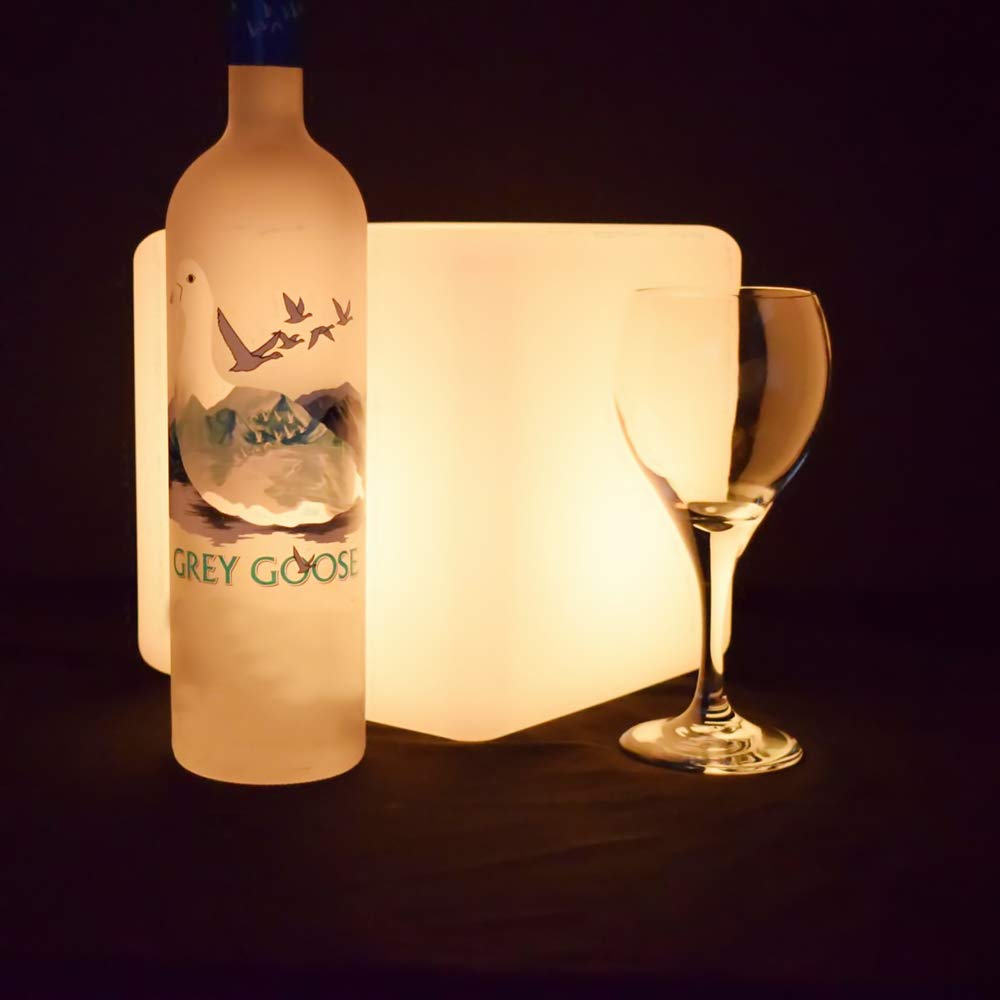 Mr.Go compact cube lamp fits shelves or tabletops for ambient lighting.