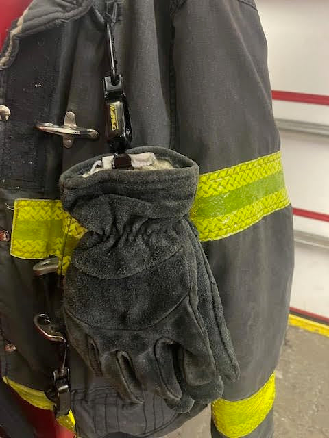 Multipurpose Webbing Inc glove clamp black variant fits standard gear.