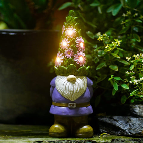 Nacome solar gnome with succulent and LED lights enhances outdoor ambiance.