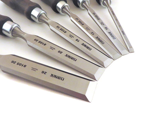 Narex chisels arranged in wooden presentation box for organized workshop use.