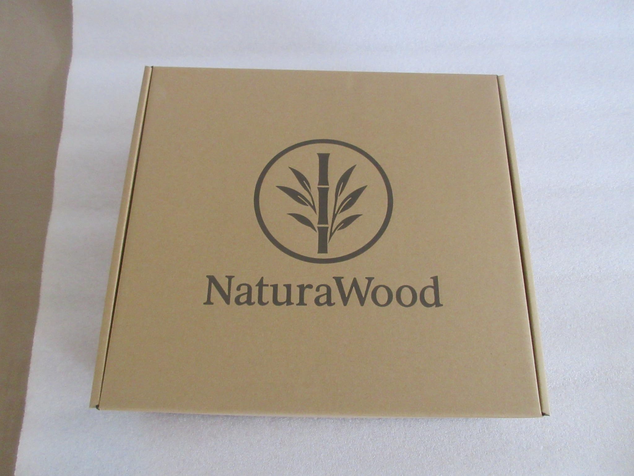 NaturaWood multi-roll storage holds spare toilet paper for quick refreshes.