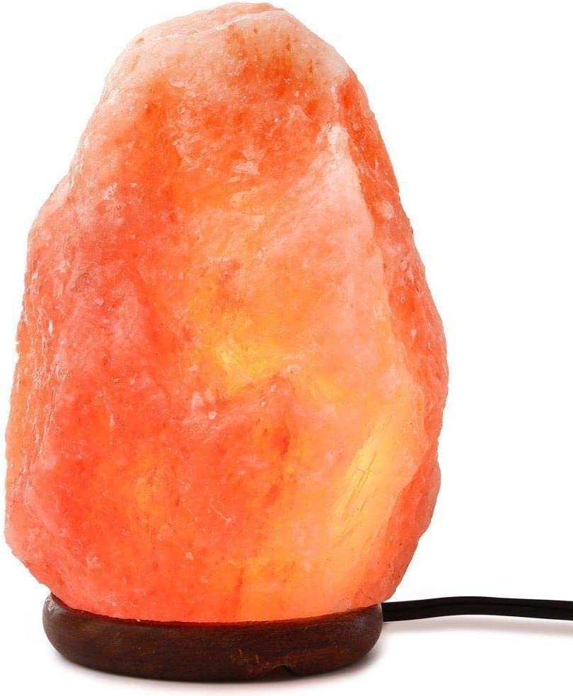 Needs&Gifts wooden base complements rustic decor with a handcrafted salt lamp.