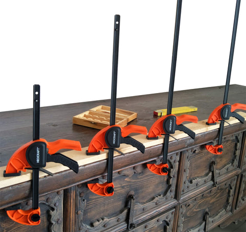 Neocraft clamps in woodworking and furniture assembly context showing versatility