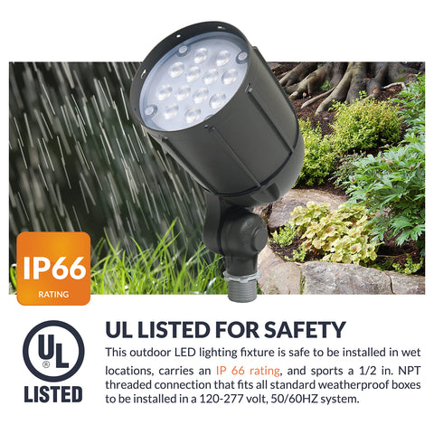 Newhouse Lighting 12W bronze flood light in a backyard landscape setting