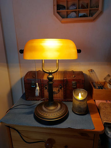 Newrays matted orange glass bankers lamp offers adjustable angle for customized lighting.