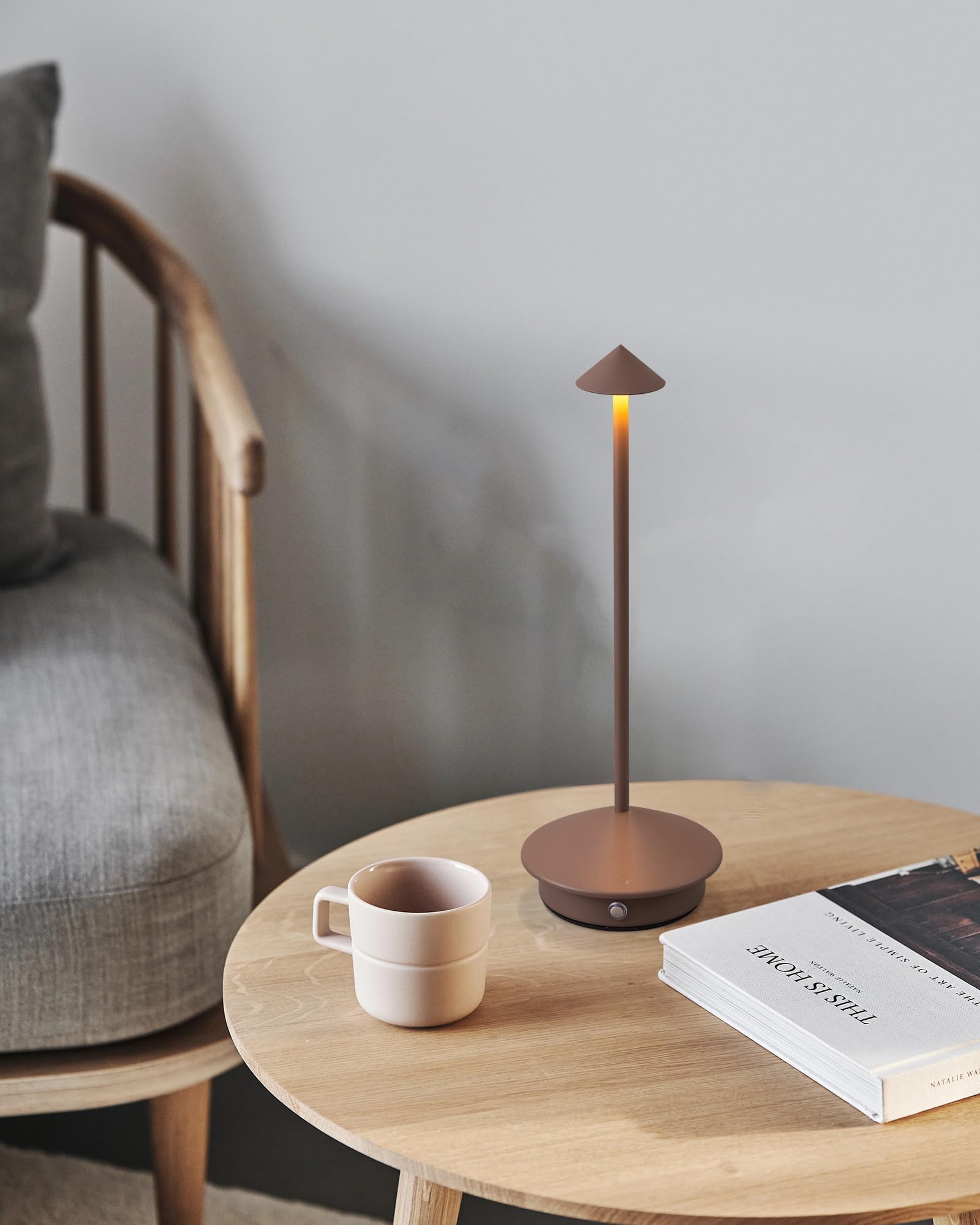 NEWSEE lamp on a cafe counter adds inviting mood lighting.