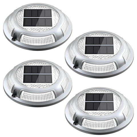 Nibuuecer solar driveway light installed on a driveway, providing durable drive-over safety for cars and trucks.