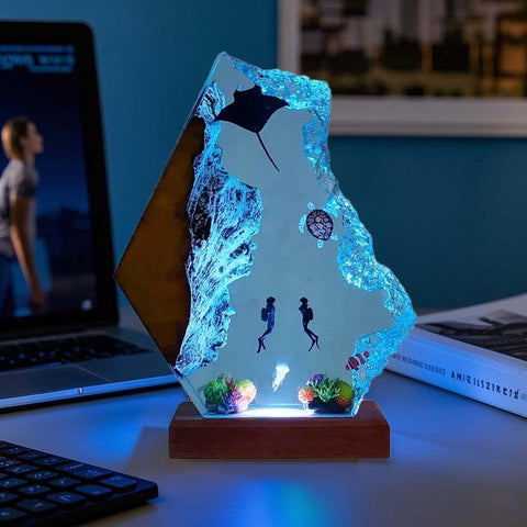 Nice Hera ocean lamp on wood base complements desks and shelves.