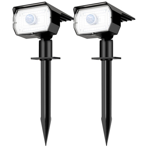 Nipify solar spot light glowing at night to warmly illuminate outdoor spaces