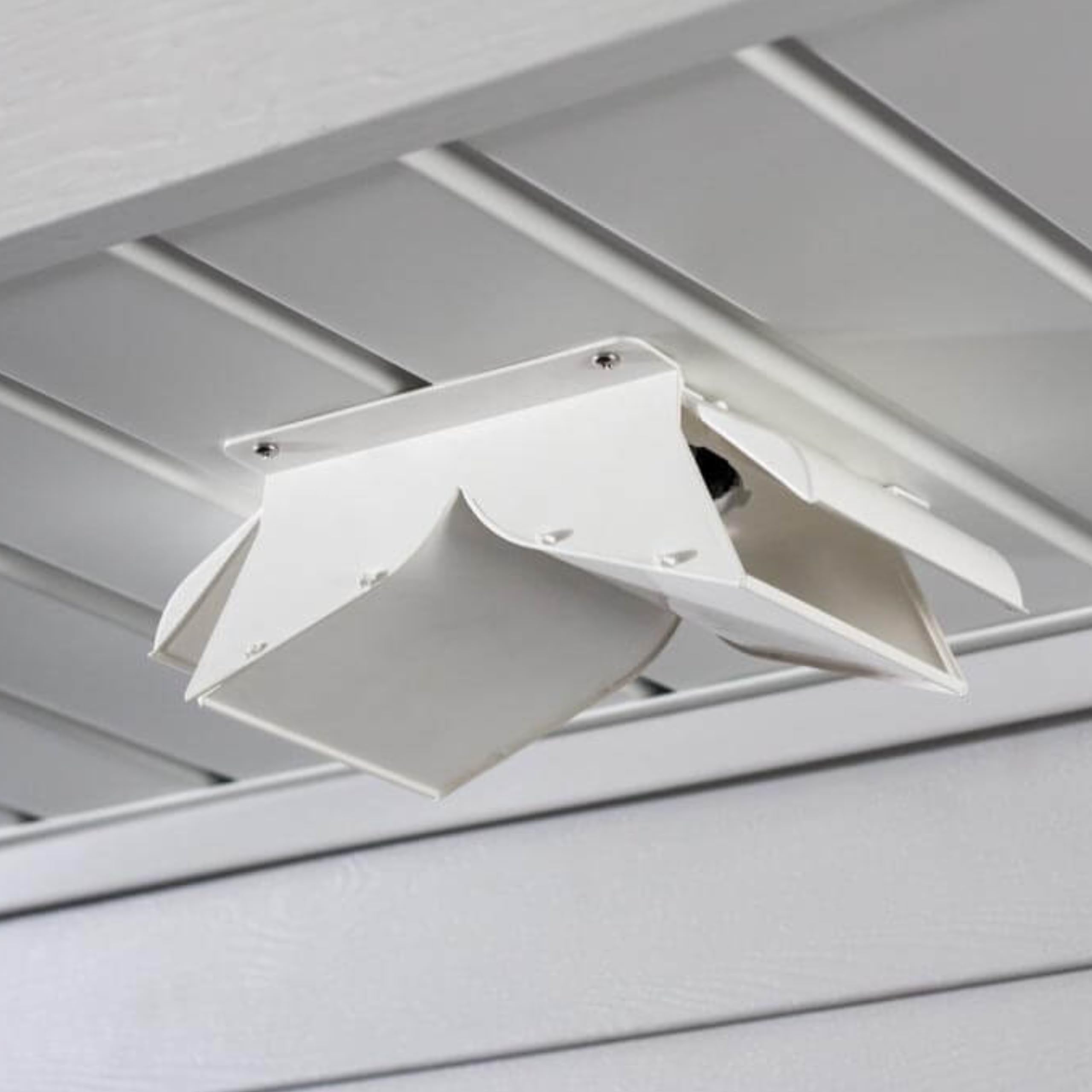 Close-up of No-Pest Vent dual-door design preventing back drafts and cold ingress.