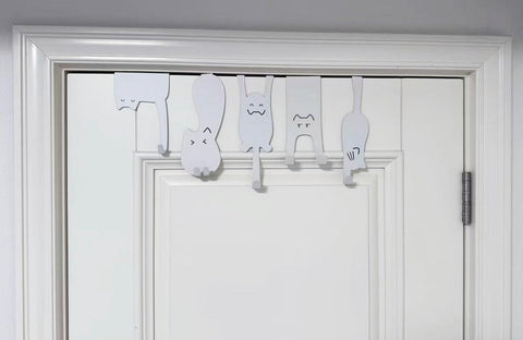 Nooboochichy over-the-door hooks behind the door enable quick organization.