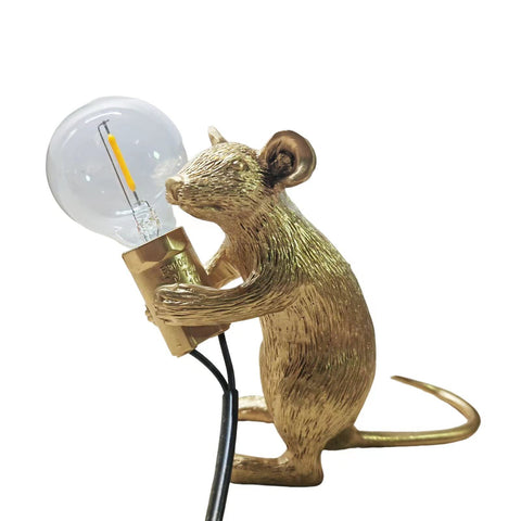 NorDiem gold sitting mouse lamp on a kid's bedside table for cozy reading
