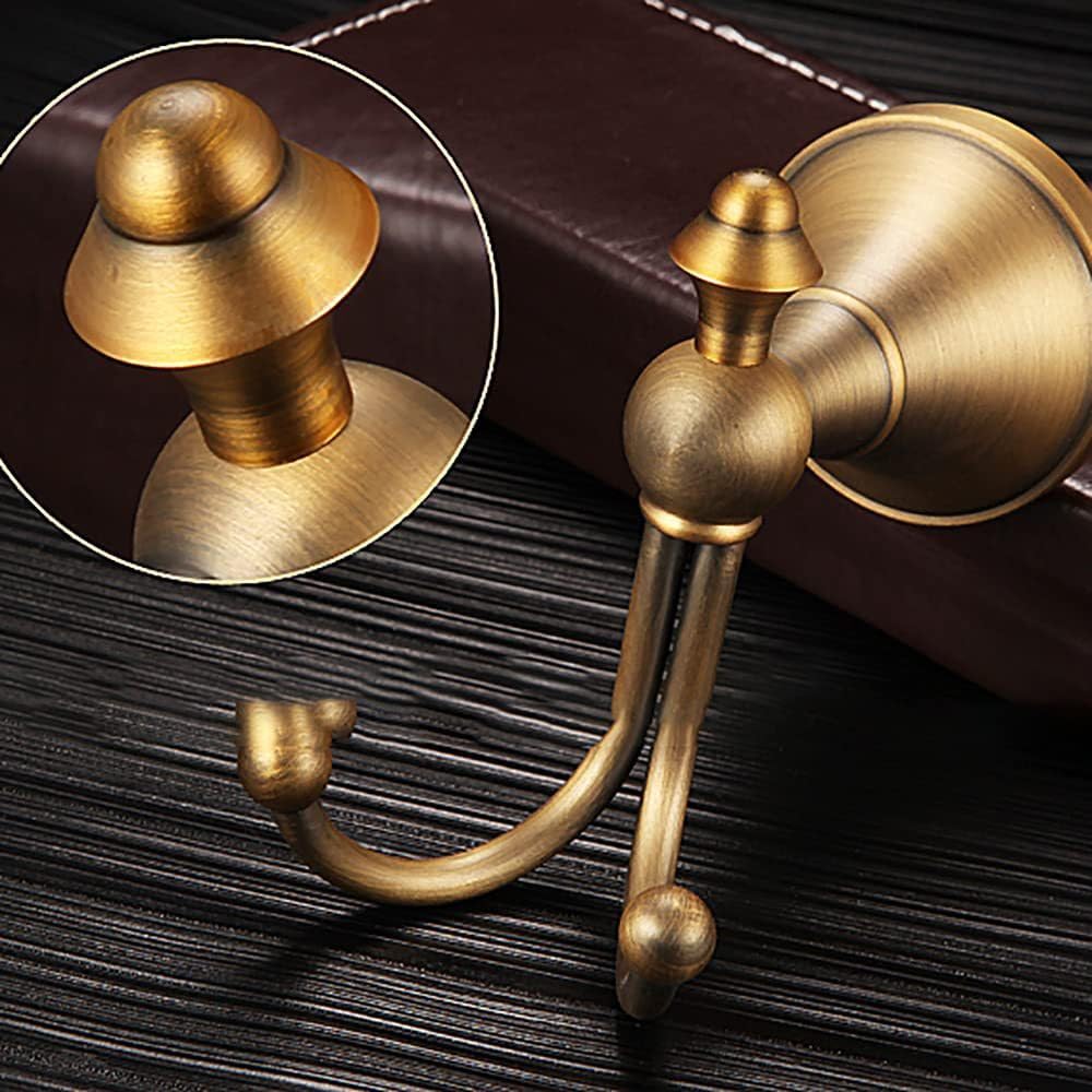 NSCMQSL antique-brass coat hook with brushed finish provides durable storage.