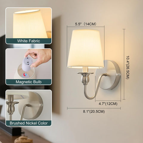 Soft fabric shade diffuses light for cozy bedroom ambience.