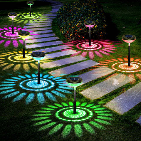 Nupostai 8-pack solar pathway light installed in a garden for ambient evening lighting.