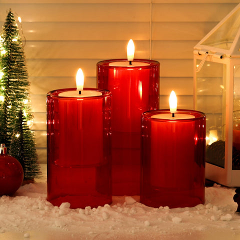 NURADA red glass candle set on a table offering elegant dining ambience