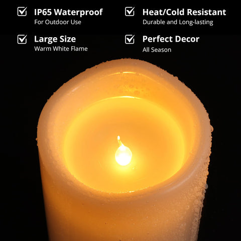 NURADA 10-inch ivory candle illuminating an outdoor space