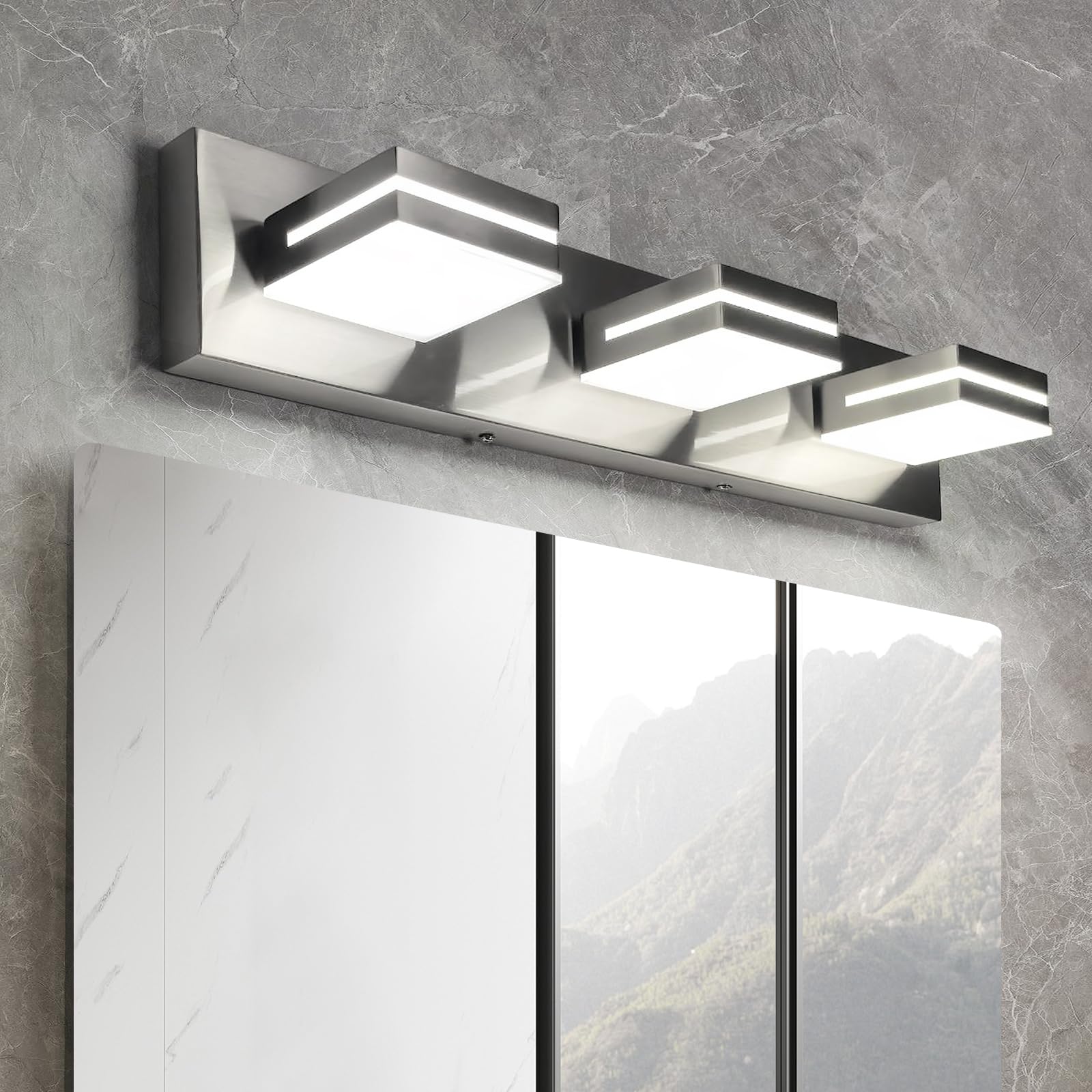 OKELI 3-light vanity fixture in brushed nickel above the mirror for a clean look