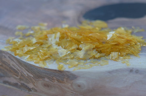 Closeup of de-waxed super blonde shellac flakes showing texture and quality for finishing