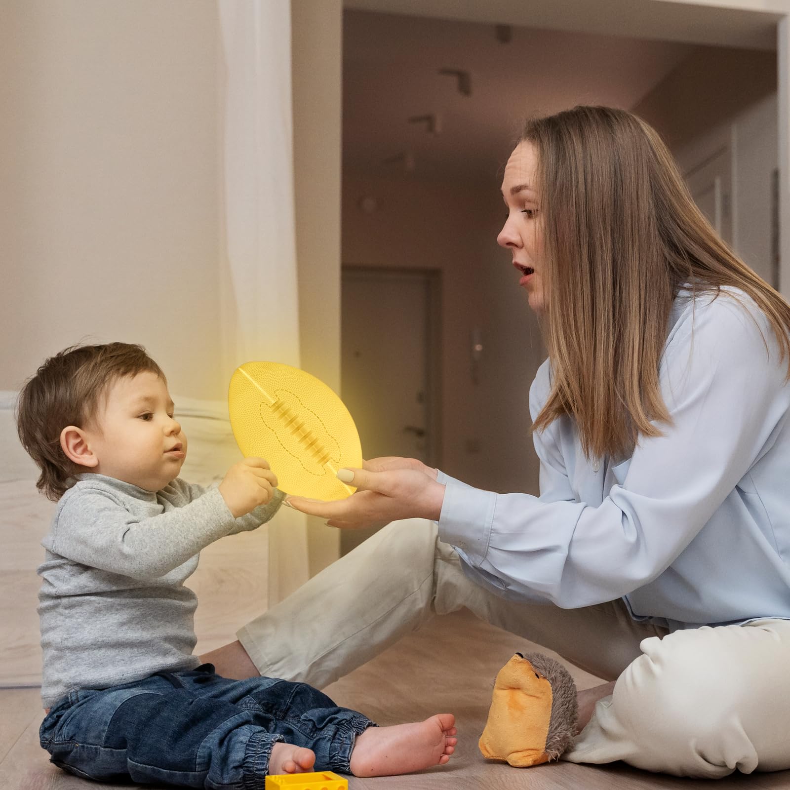 Olee Odee football lamp with soft glow on bedside table for kids.