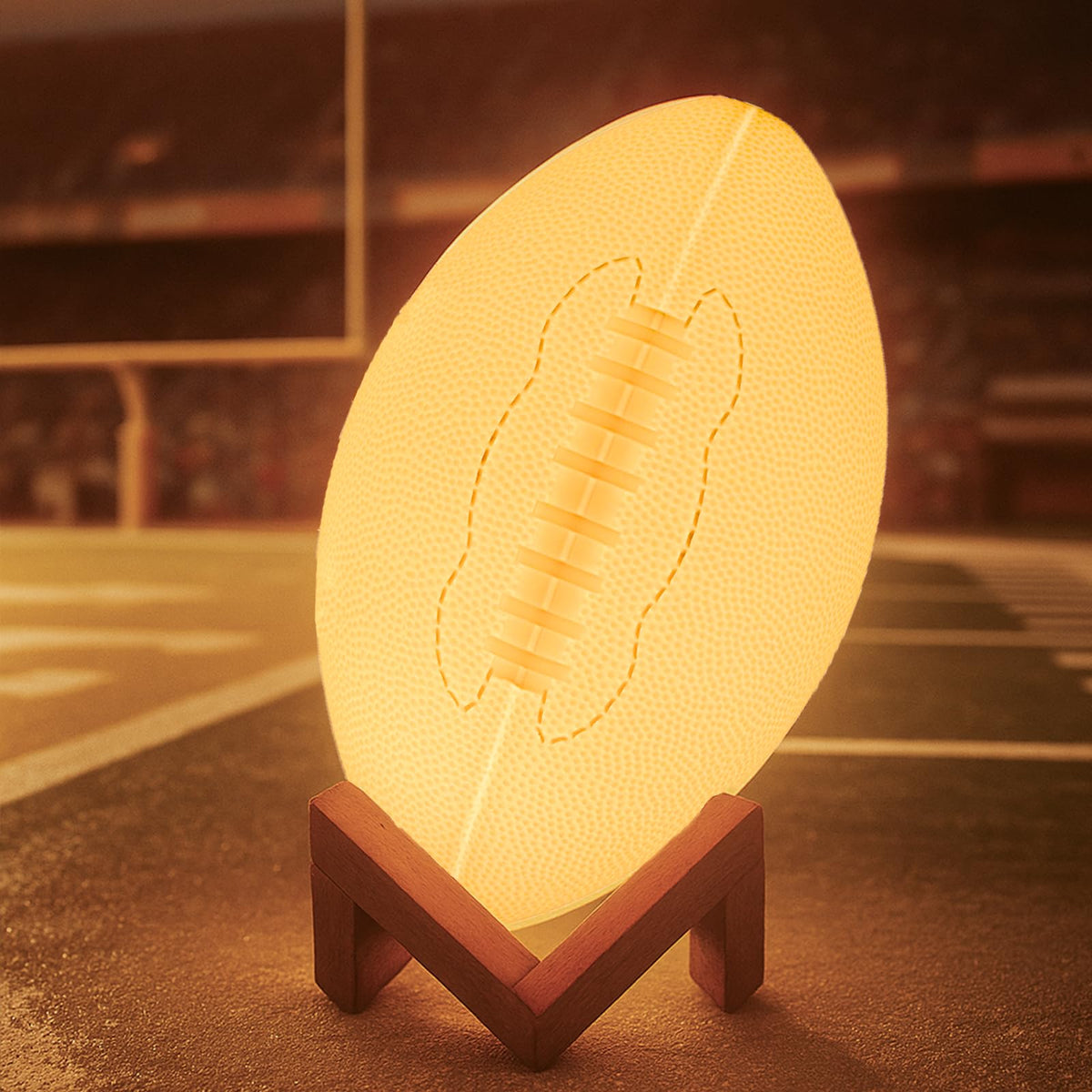 Olee Odee football night light with remote for 16-color bedside ambiance.