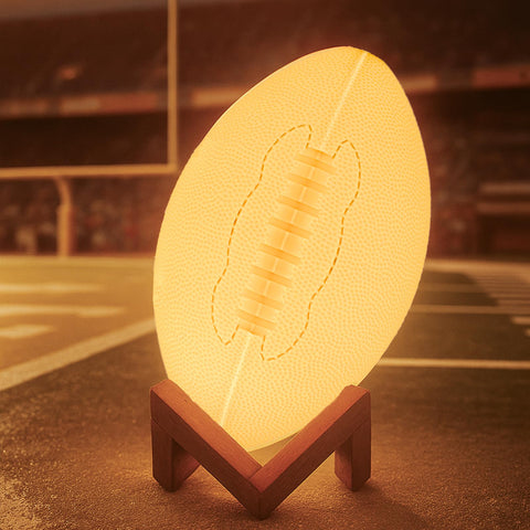 Olee Odee football night light with remote for 16-color bedside ambiance.