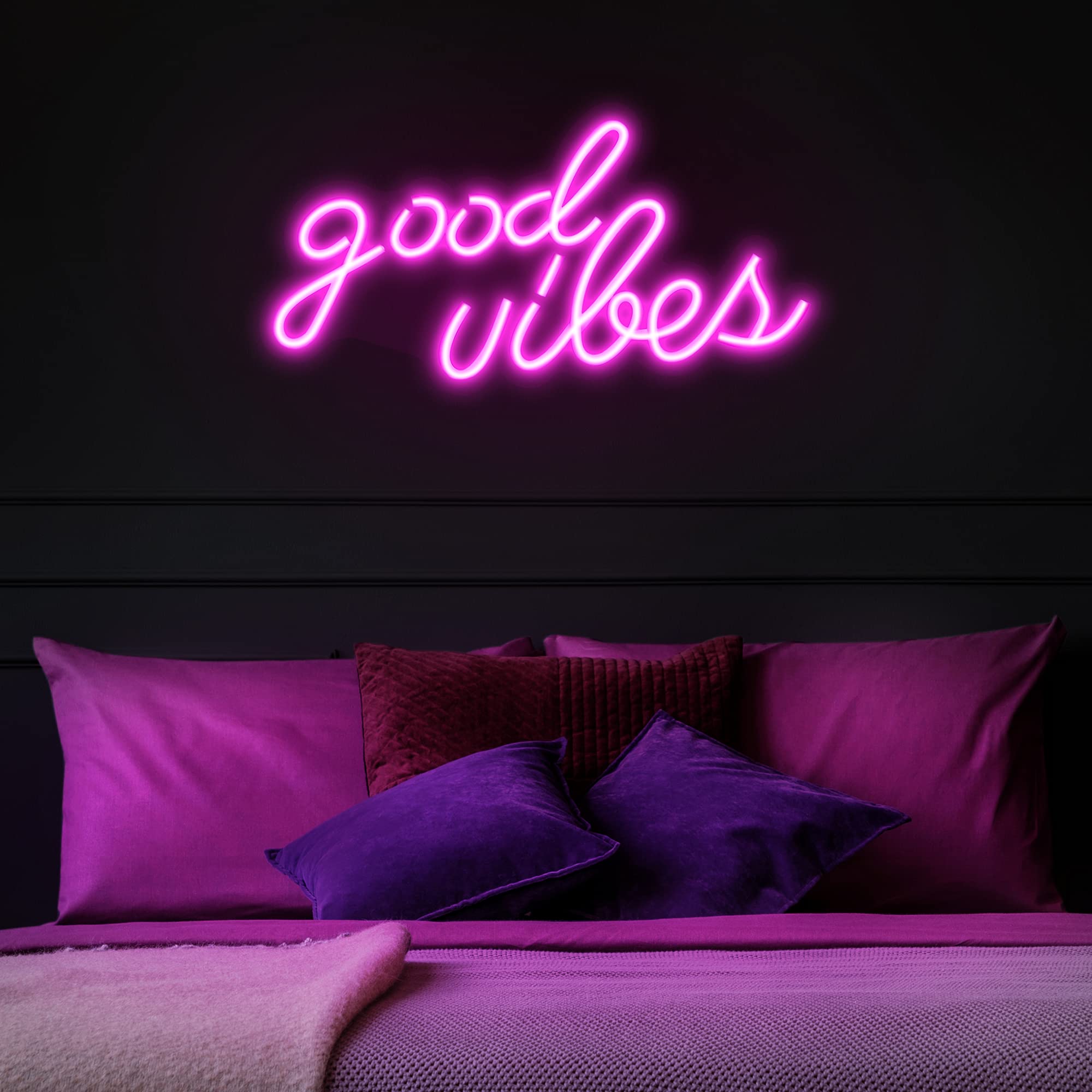 Olekki Pink Good Vibes neon sign enhances living room mood with a soft pink glow.