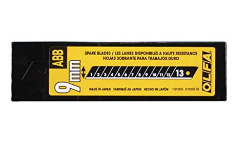 OLFA replacement blades showing clean, versatile cuts across cardboard and vinyl.