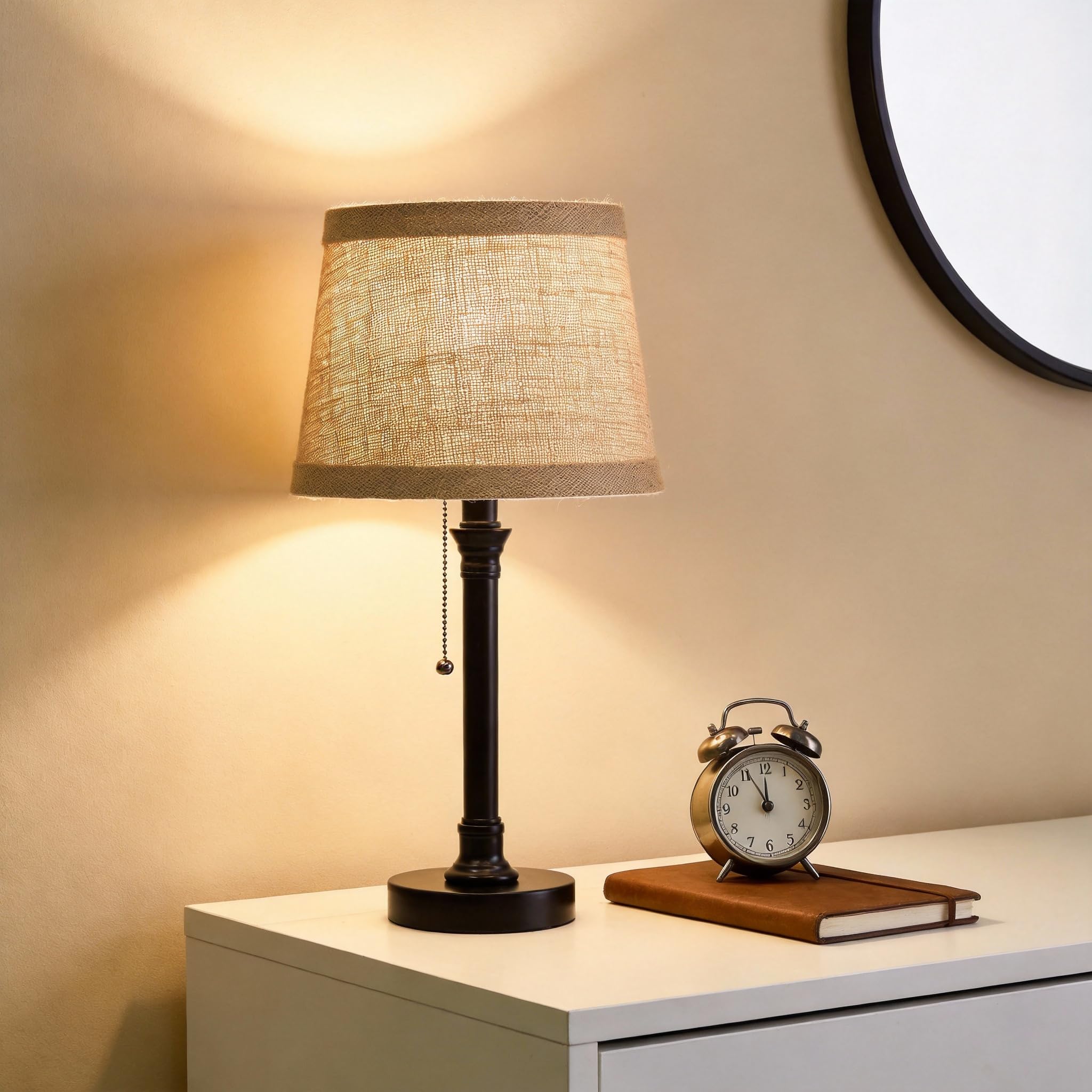 Oneach lamps glow softly on a nightstand for reading and ambiance.