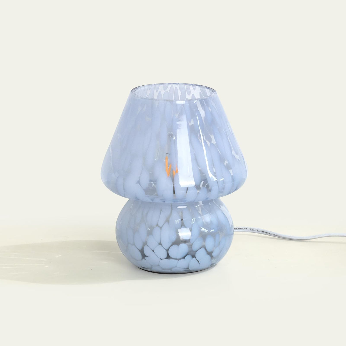 ONEWISH Mushroom Lamp close-up shows Murano-blue glass with translucent shimmer