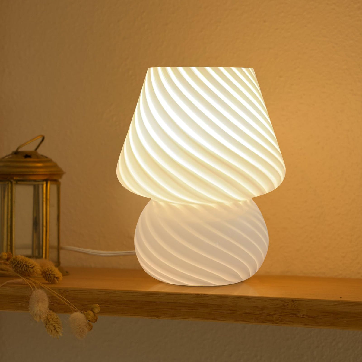 ONEWISH mushroom lamp with striped glass base provides a cozy glow for stylish spaces.