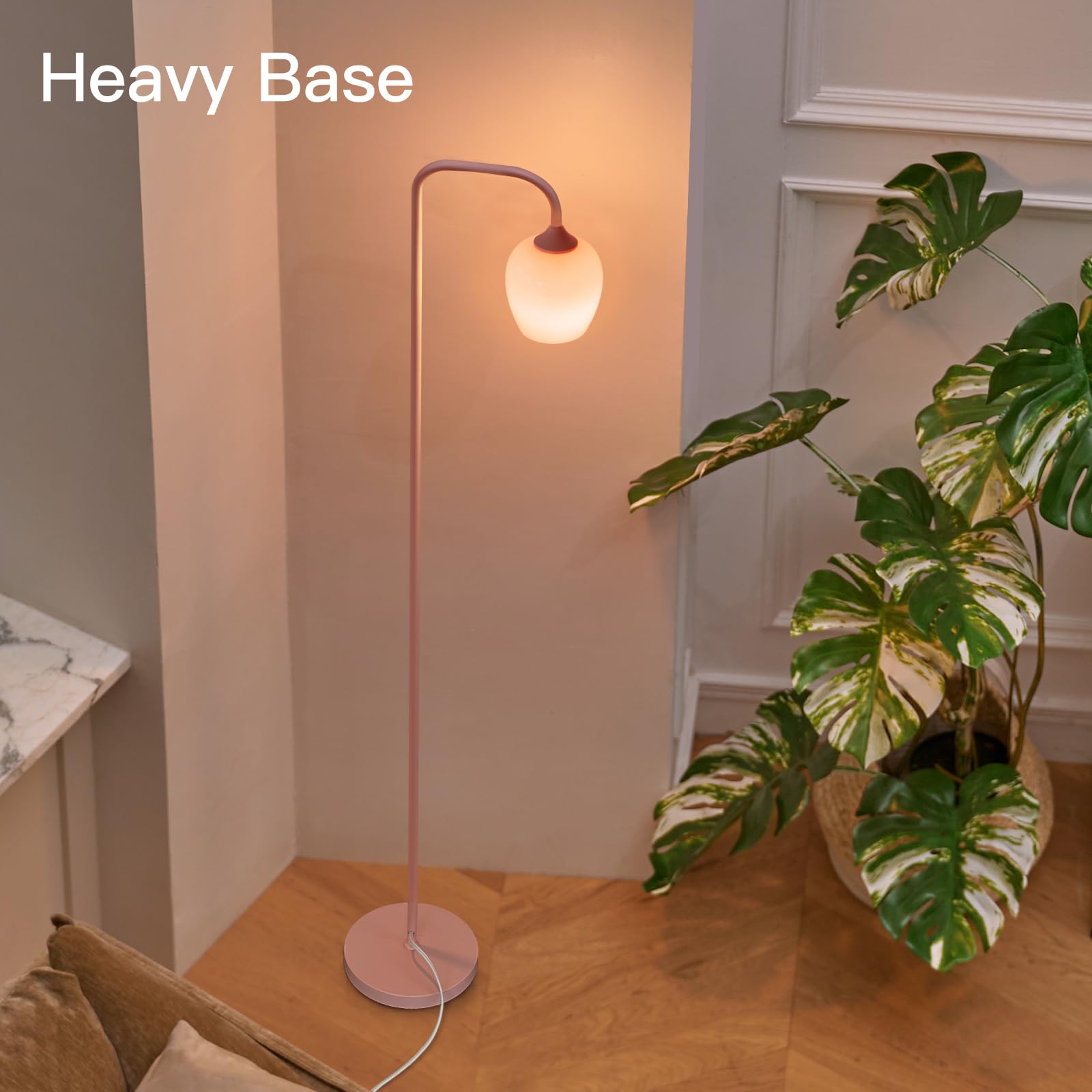 ONEWISH pink floor lamp beside a bed providing gentle reading light