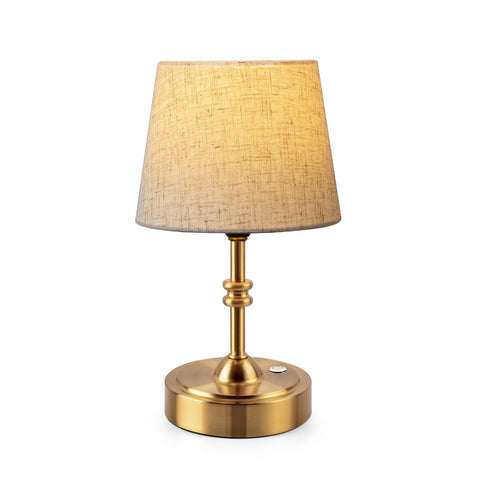 OneWISH small cordless lamp with beige shade provides warm ambient lighting.