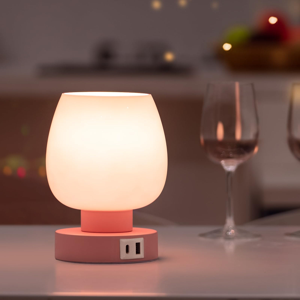 Onewish touch bedside lamp with pink glass shade provides soft ambient light for bedrooms.