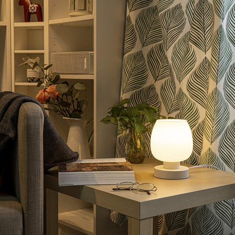 ONEWISH Touch bedside lamp emits warm 3000K light for cozy evenings.