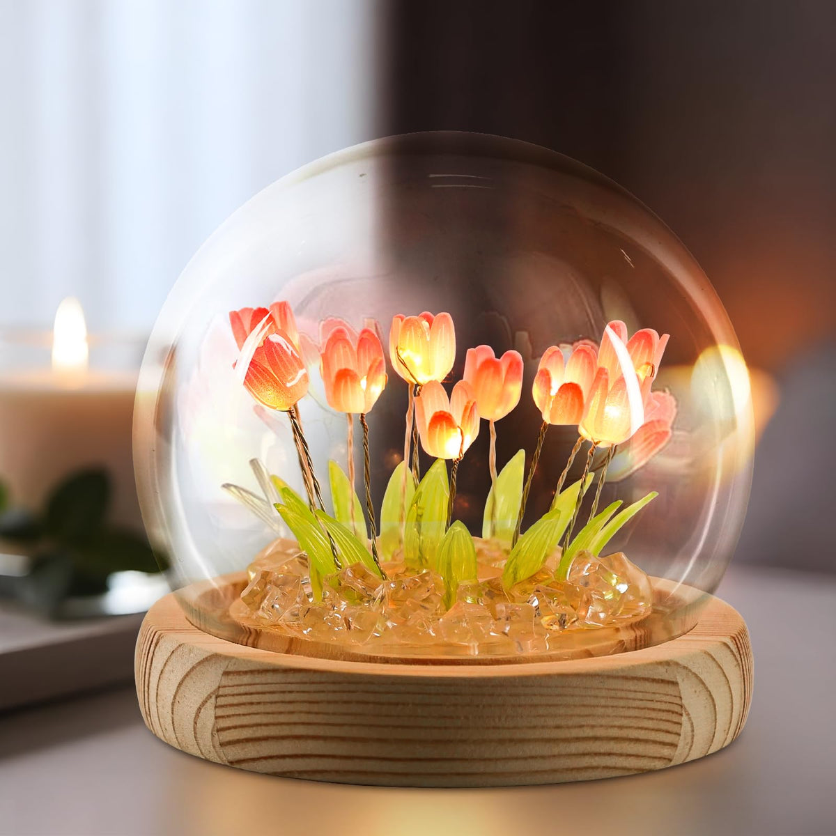 ONXE Tulips night light in pink glow on a bedside table, adding cozy ambiance