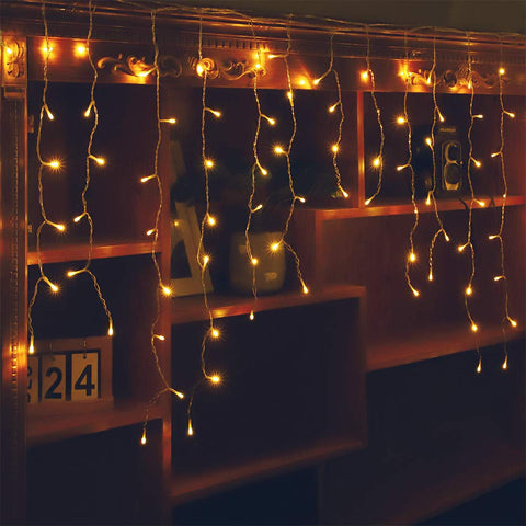 Orangie LED Icicle Lights provide a wide warm glow for festive décor and backdrop visibility.