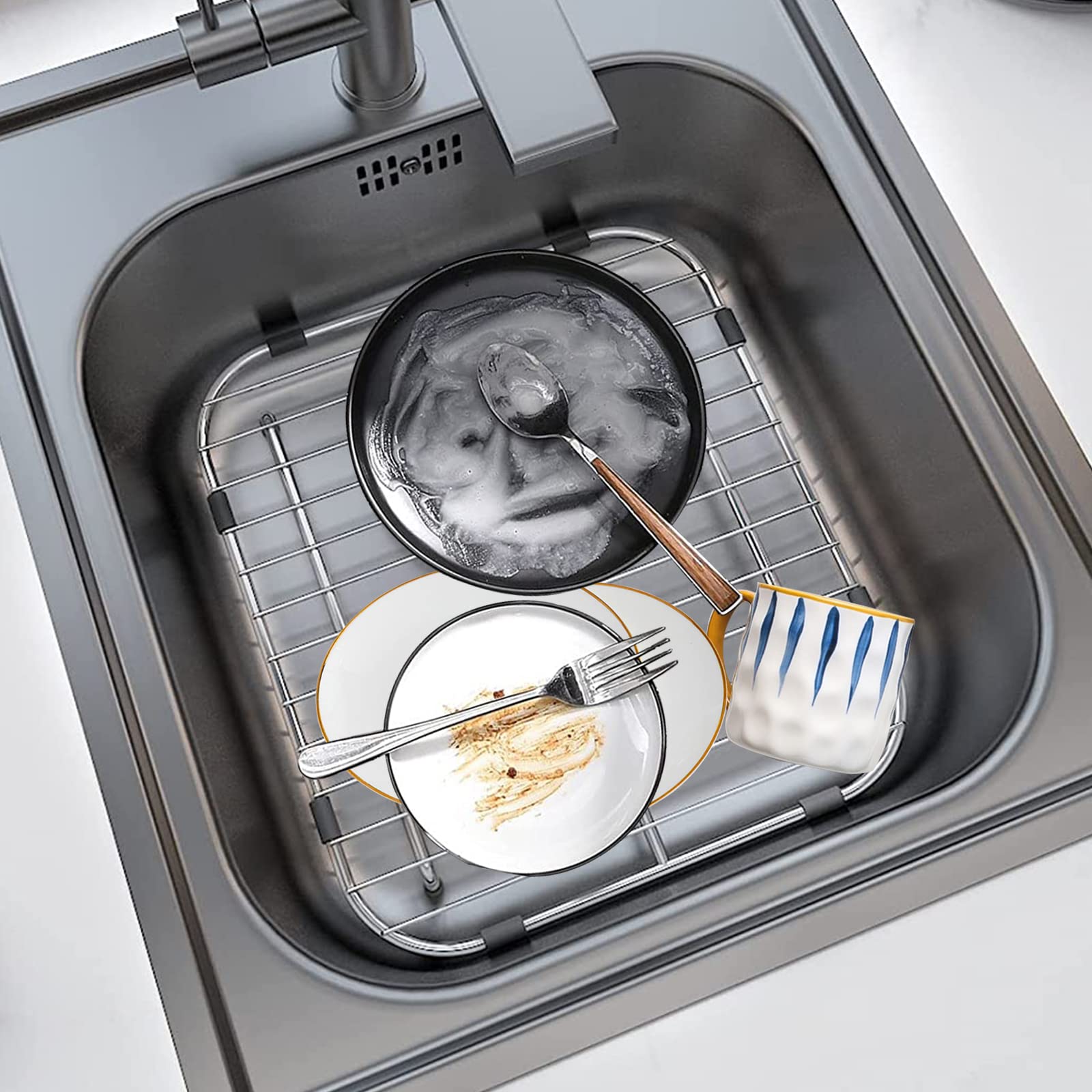 Orgneas sink grid improves drainage by letting water flow beneath dishes