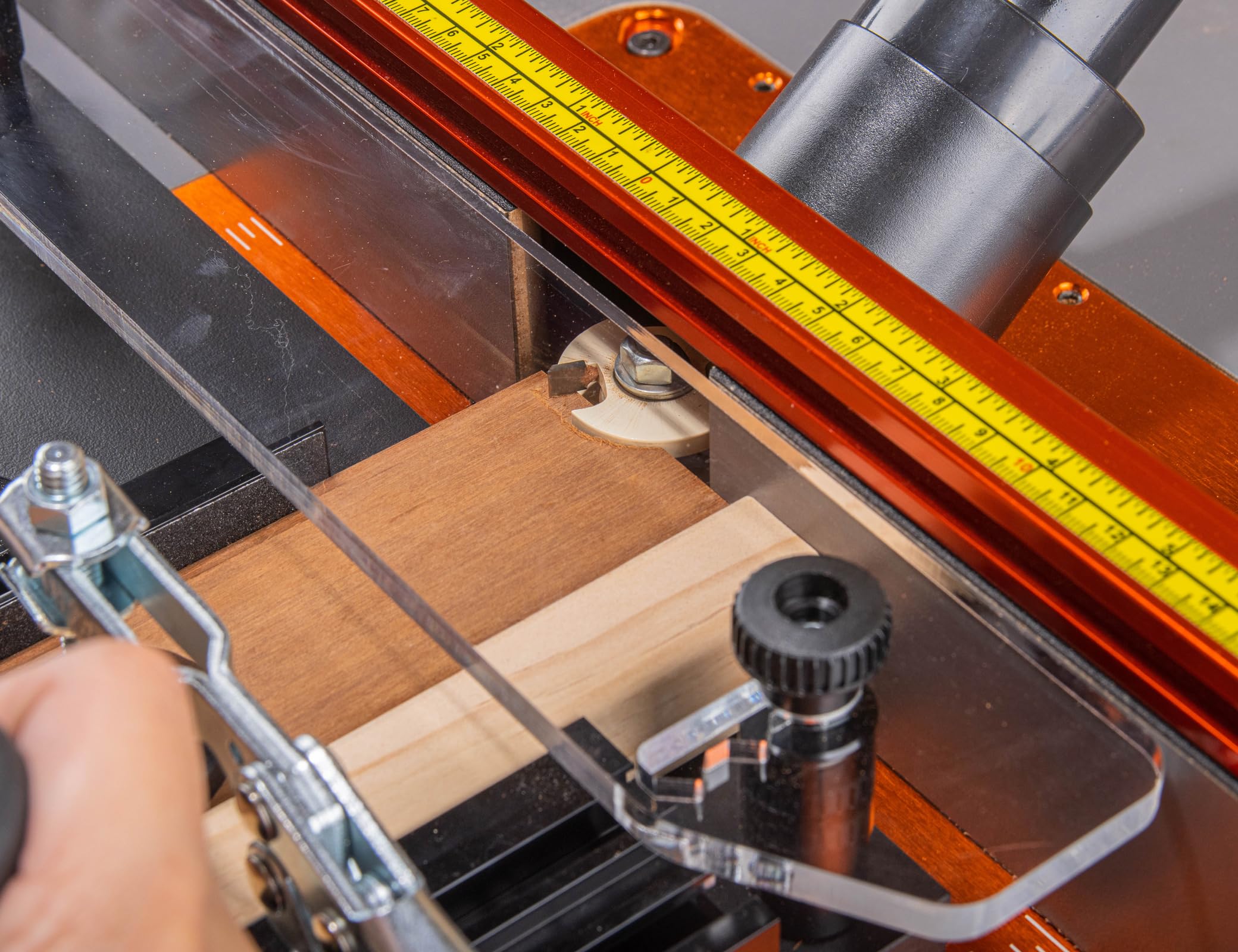 O'SKOOL Sacrificial fence stabilizes stock and reduces tear-out.