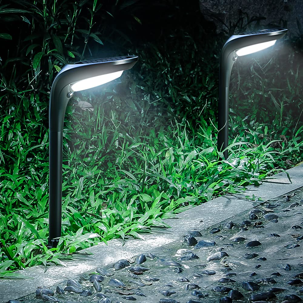 OSORD solar pathway light with ground stake illuminating a garden path at dusk