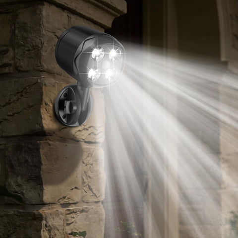 OTTYMER garden motion sensor light activates to brighten the walkway after dusk.