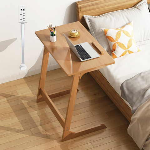 Electrical Outlet Extender tucked behind a couch reveals accessible outlets